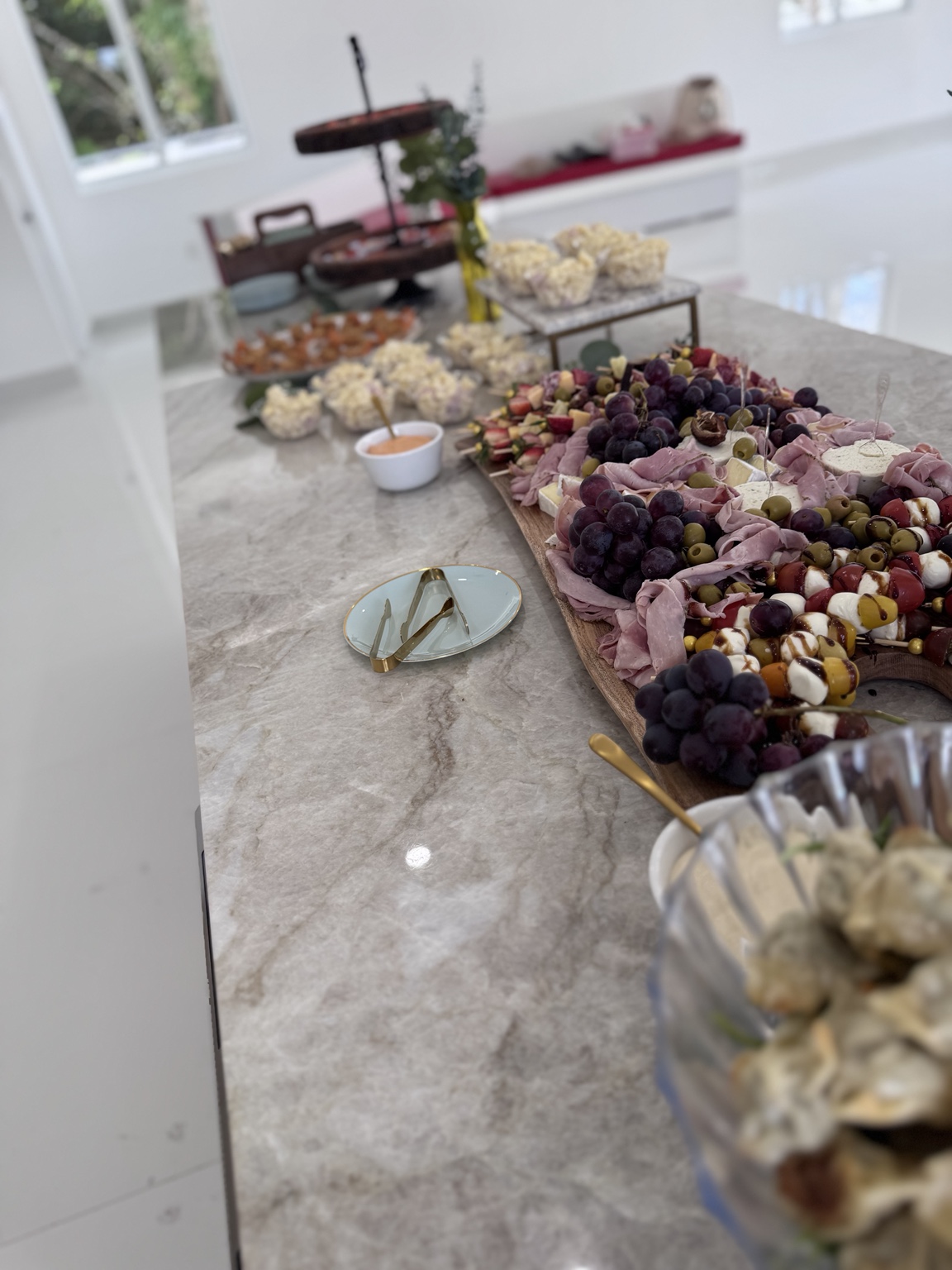 Catering table with charcuterie and fresh fruit
