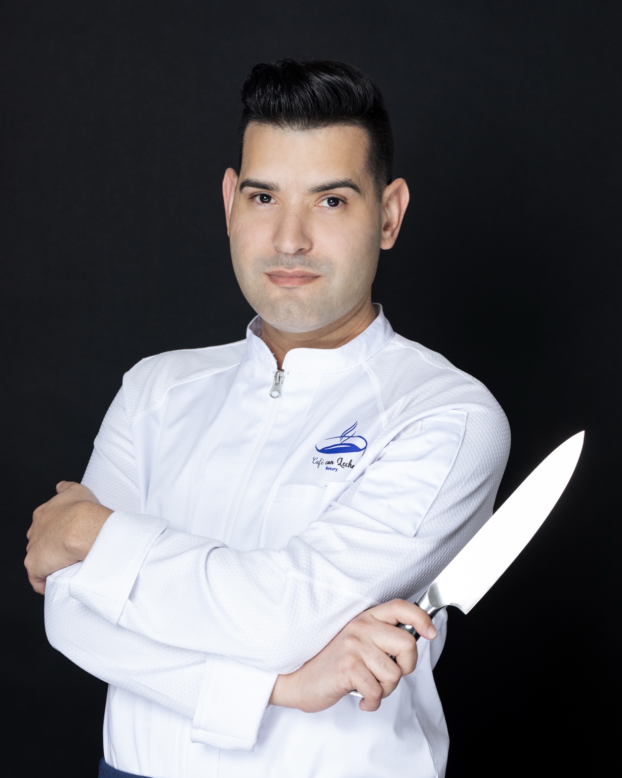 Chef Yadiel holding a chef’s knife